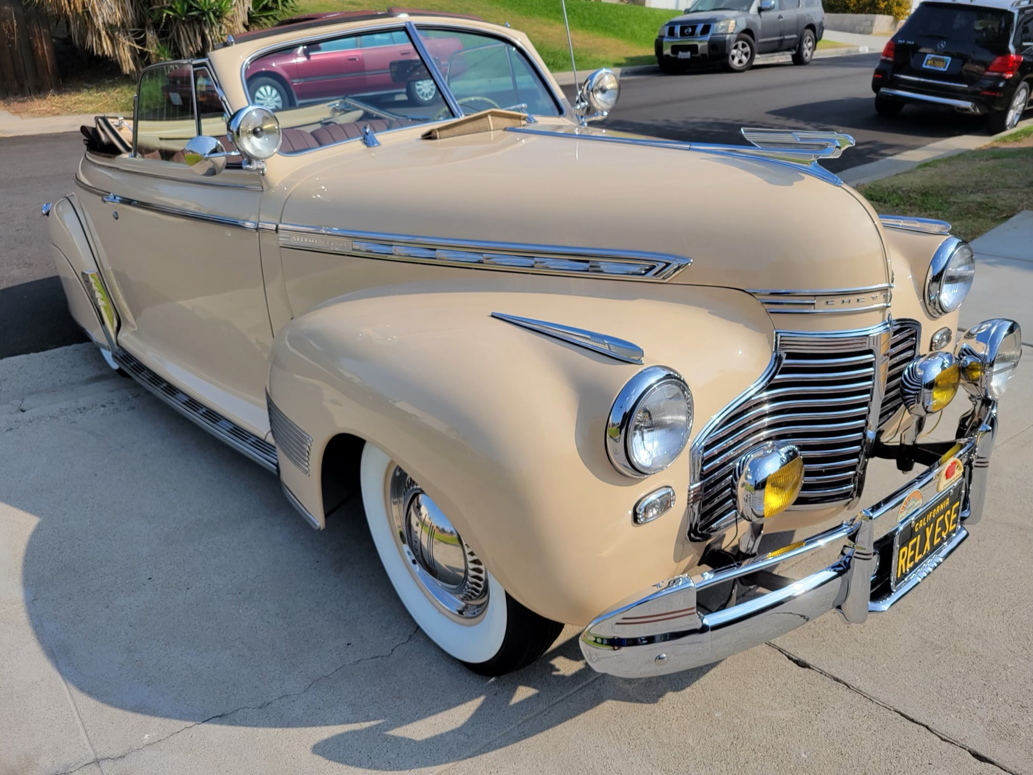 Cream convertible Chevrolet.